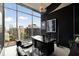 Modern office space with large windows offering panoramic city views and stylish black decor at 860 Peachtree Ne St # 2801, Atlanta, GA 30308
