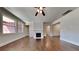 Bright living room with hardwood floors, a cozy fireplace, and lots of natural light at 9866 Garden Hill Ln, Douglasville, GA 30135