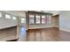 Spacious living room with hardwood floors, and large windows at 9866 Garden Hill Ln, Douglasville, GA 30135