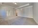 Spacious main bedroom with tray ceiling, carpeted floors, and two doorways at 9866 Garden Hill Ln, Douglasville, GA 30135