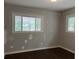 Bedroom with hardwood floors and two windows with natural light at 172 Camp Sunrise Nw Rd, Cartersville, GA 30121