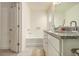 Bright bathroom featuring a tub-shower combo and vanity with granite countertop at 1884 Plainsboro Dr, Lithonia, GA 30058