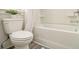 Bathroom featuring a commode and tub with shower at 1884 Plainsboro Dr, Lithonia, GA 30058