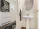 Chic half-bathroom with a modern pedestal sink and stylish decor at 1884 Plainsboro Dr, Lithonia, GA 30058