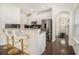 Modern kitchen featuring white cabinets, granite countertops, stainless steel appliances, and bar seating at 1884 Plainsboro Dr, Lithonia, GA 30058