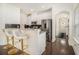 Modern kitchen with white cabinets, granite countertops, stainless steel appliances and a breakfast bar at 1884 Plainsboro Dr, Lithonia, GA 30058
