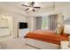 Cozy bedroom with a tray ceiling, neutral tones, and an ensuite bathroom at 1884 Plainsboro Dr, Lithonia, GA 30058