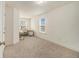Neutral office with ample space, carpet, and natural light at 1884 Plainsboro Dr, Lithonia, GA 30058