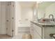 Bright bathroom featuring a dual sink vanity with granite countertops, bathtub, and a neutral color palette at 1884 Plainsboro Drive Dr, Lithonia, GA 30058