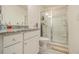 Contemporary bathroom with granite countertop vanity, toilet, and glass-enclosed shower stall at 1884 Plainsboro Drive Dr, Lithonia, GA 30058
