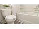 Bathroom featuring a toilet and tub with shower at 1884 Plainsboro Drive Dr, Lithonia, GA 30058