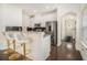 Modern kitchen with white cabinets, stainless steel appliances, and a breakfast bar with seating at 1884 Plainsboro Drive Dr, Lithonia, GA 30058