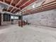 Unfinished basement with concrete flooring, exposed beams, ductwork, and block foundation walls at 301 Jetta Ln, Canton, GA 30115