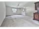 Expansive carpeted basement area with bright windows and a rustic decorative cabinet at 301 Jetta Ln, Canton, GA 30115