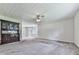 Open basement space with carpet flooring, a vintage cabinet, and natural lighting at 301 Jetta Ln, Canton, GA 30115
