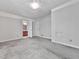 A bedroom leads to a view of a bathroom with carpeted floors at 301 Jetta Ln, Canton, GA 30115