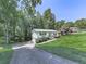 Exterior of home showcasing driveway, green lawn and curb appeal at 301 Jetta Ln, Canton, GA 30115