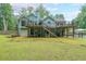 Expansive backyard showcasing multi-level decks, a pool, and plenty of green space for outdoor activities at 58 First Manassas E Way, Sharpsburg, GA 30277