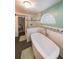 Luxurious bathroom featuring standalone tub and decorative window at 58 First Manassas E Way, Sharpsburg, GA 30277
