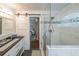 Modern bathroom featuring a glass shower and double sinks at 58 First Manassas E Way, Sharpsburg, GA 30277