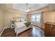 Comfortable bedroom boasts trey ceiling and hardwood floors at 58 First Manassas E Way, Sharpsburg, GA 30277