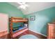 Cozy bedroom featuring bunk beds, hardwood floors, and ample natural light at 58 First Manassas E Way, Sharpsburg, GA 30277
