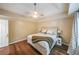 Comfortable bedroom boasts trey ceiling and hardwood floors at 58 First Manassas E Way, Sharpsburg, GA 30277