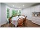 Charming dining area featuring hardwood floors, a bay window, and built-in cabinets at 58 First Manassas E Way, Sharpsburg, GA 30277