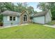 Charming home features a well-manicured lawn and appealing stone accents at 58 First Manassas E Way, Sharpsburg, GA 30277