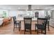 Beautiful kitchen features a center island, stainless appliances and white cabinetry at 58 First Manassas E Way, Sharpsburg, GA 30277