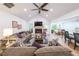 Bright open concept living room with vaulted ceilings, fireplace, open to the kitchen at 58 First Manassas E Way, Sharpsburg, GA 30277