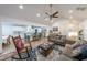 Bright, open-concept living space with vaulted ceilings, a modern ceiling fan, and cozy furniture at 58 First Manassas E Way, Sharpsburg, GA 30277