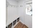 Convenient mudroom with built-in bench, storage cubbies, and access to the garage at 58 First Manassas E Way, Sharpsburg, GA 30277