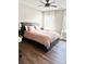 Inviting bedroom with hardwood floors, neutral walls, and a comfortable bed dressed in plush bedding at 6128 Lanier Harbor Lndg, Buford, GA 30518