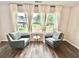 Cozy sitting area with large windows offering serene views and comfortable seating at 6128 Lanier Harbor Lndg, Buford, GA 30518