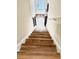 Stairway with wood steps and white risers leading to an inviting entrance door at 6128 Lanier Harbor Lndg, Buford, GA 30518