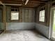 Unfinished basement featuring windows and waterproofing membrane at 7235 Thornhill Ne Ln, Atlanta, GA 30328