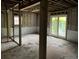 Unfinished basement with potential for customization, natural light, and slider door at 7235 Thornhill Ne Ln, Atlanta, GA 30328
