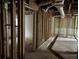Unfinished basement with exposed framing, utilities, and concrete flooring at 7235 Thornhill Ne Ln, Atlanta, GA 30328