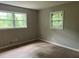 Bedroom featuring a view of backyard with refinished hardwood floors and neutral wall color to make your own at 7235 Thornhill Ne Ln, Atlanta, GA 30328