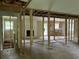 Open-concept living area ready for renovation, featuring a fireplace and natural light at 7235 Thornhill Ne Ln, Atlanta, GA 30328