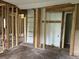 Exposed frame in an unfinished living room showcases potential layout at 7235 Thornhill Ne Ln, Atlanta, GA 30328