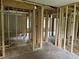 Unfinished living room featuring exposed framing and subflooring at 7235 Thornhill Ne Ln, Atlanta, GA 30328