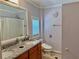Inviting bathroom with granite double vanity, a window for natural light, and a separate toilet area at 7326 Leland Ln, Jonesboro, GA 30236