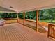 Overlooking a lush yard, this spacious wood deck offers an outdoor retreat with scenic views at 7326 Leland Ln, Jonesboro, GA 30236