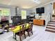 Functional kitchen with stainless steel appliances, white tile floors and a cozy dining area at 7326 Leland Ln, Jonesboro, GA 30236