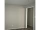 A spacious room features sleek gray floors, and neutral walls creating a versatile space ready for personalization and comfort at 971 Canyon Sw Trl, Marietta, GA 30060
