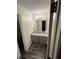 Modern bathroom featuring a vanity with granite countertop and wood-look flooring at 1263 Brookstone Rd, Atlanta, GA 30349