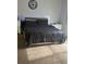 Cozy bedroom with a large bed, carpet, and illuminated headboard at 1263 Brookstone Rd, Atlanta, GA 30349