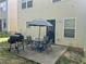 Backyard patio with outdoor dining set and barbecue grill at 1263 Brookstone Rd, Atlanta, GA 30349